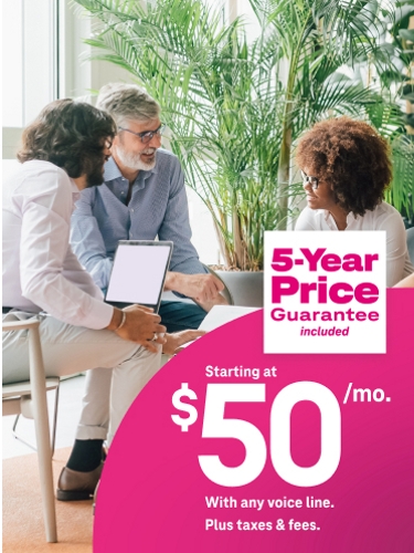 Four business people around table with computer