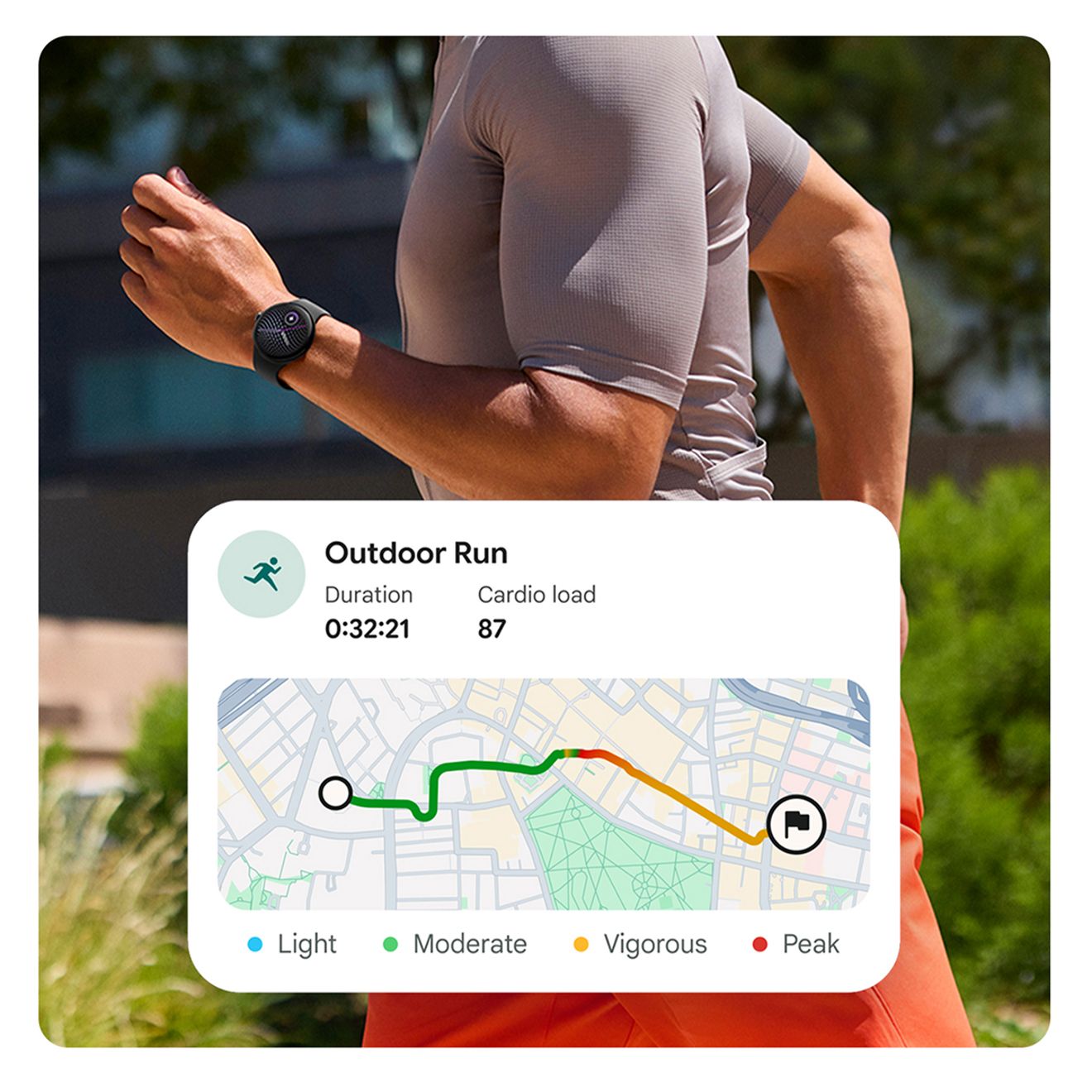 Man runs outside past office building on a tree-lined street. His Google Pixel Watch 5 (41mm) maps the course and shows his duration and cardio load.  