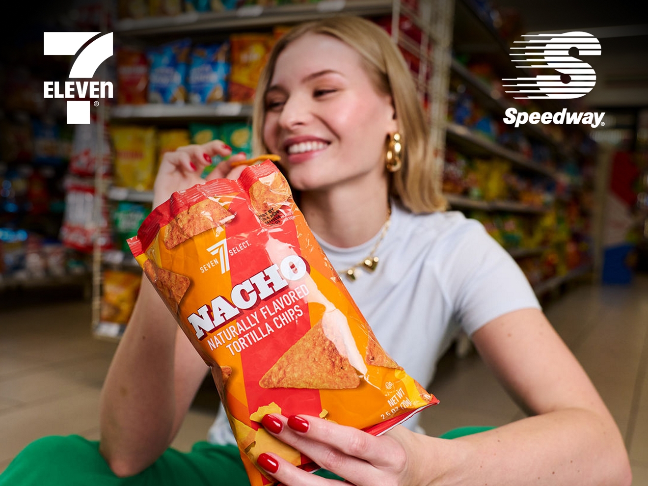 A woman is enjoying eating from a bag of chips.