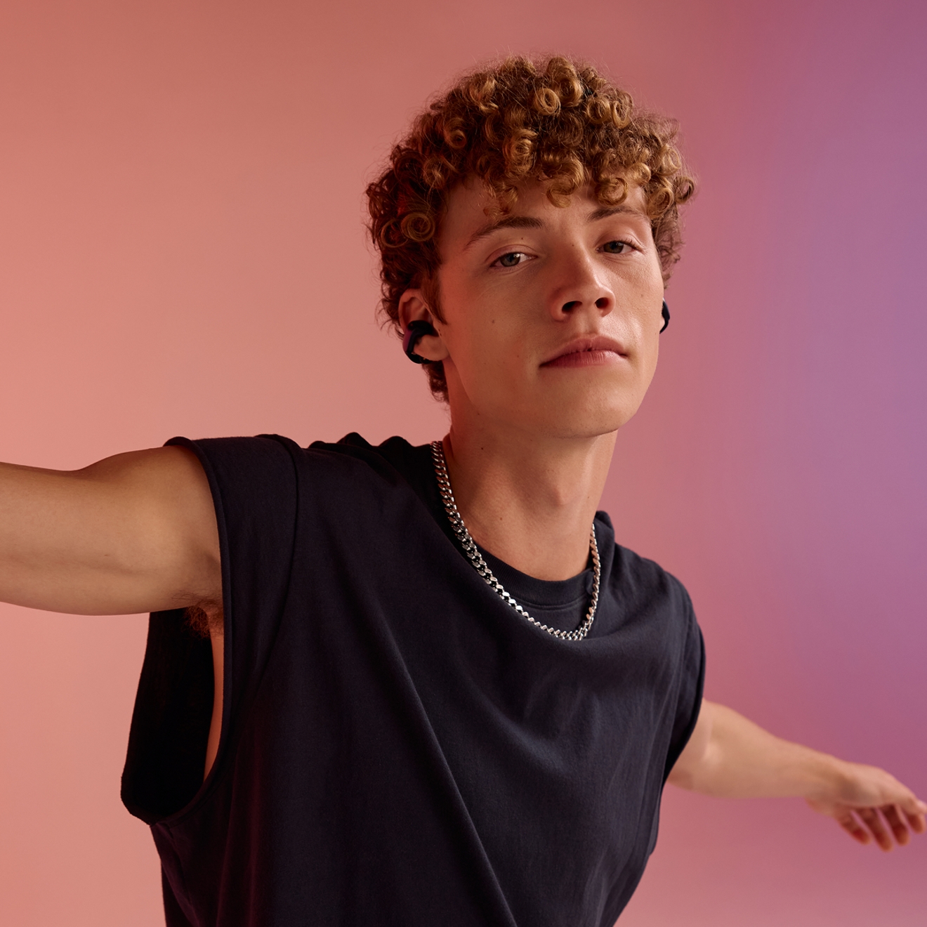 Man listening to music with Bose Ultra Open Earbuds.