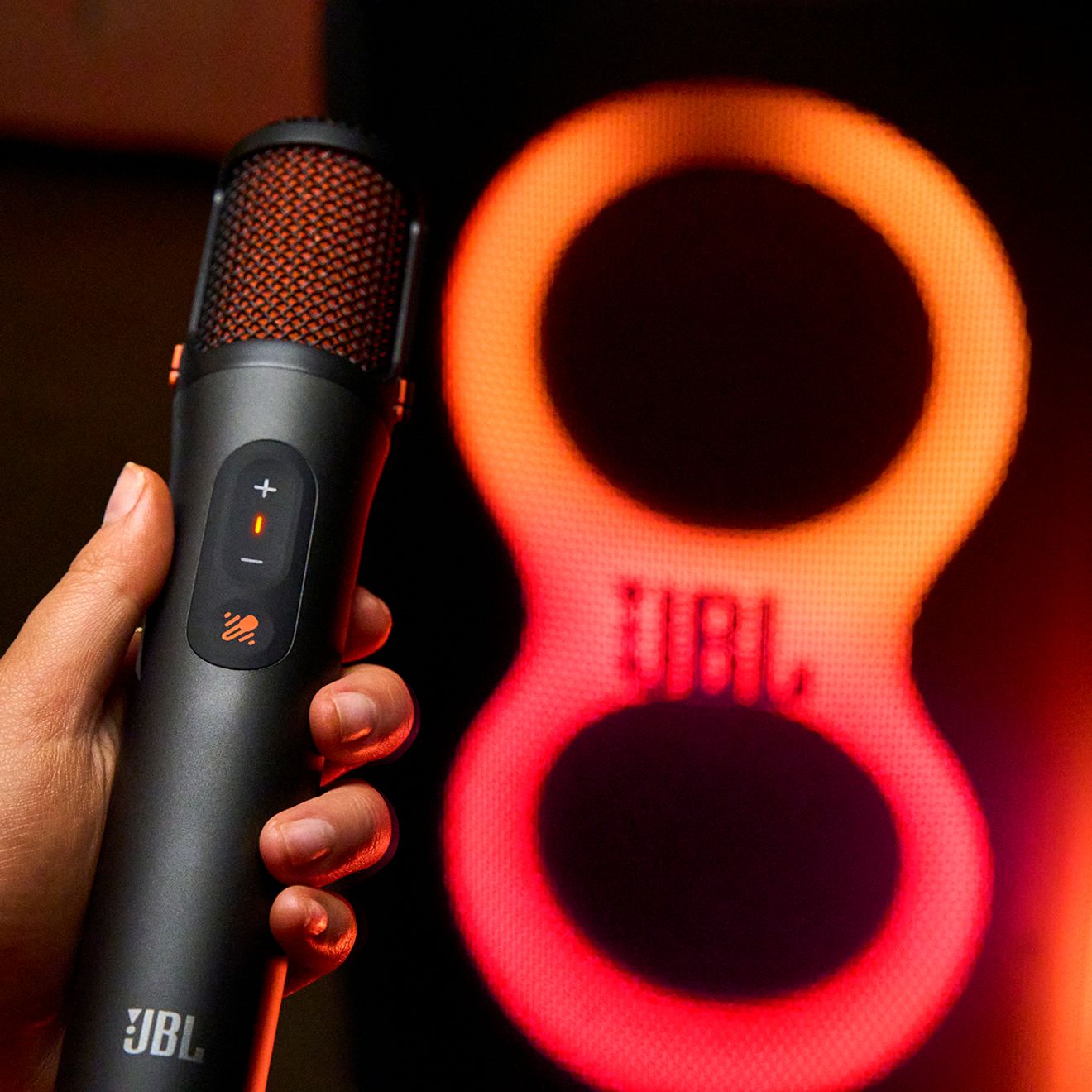 A close-up of the JBL Easy Sing Mics 2 on a black backdrop. 