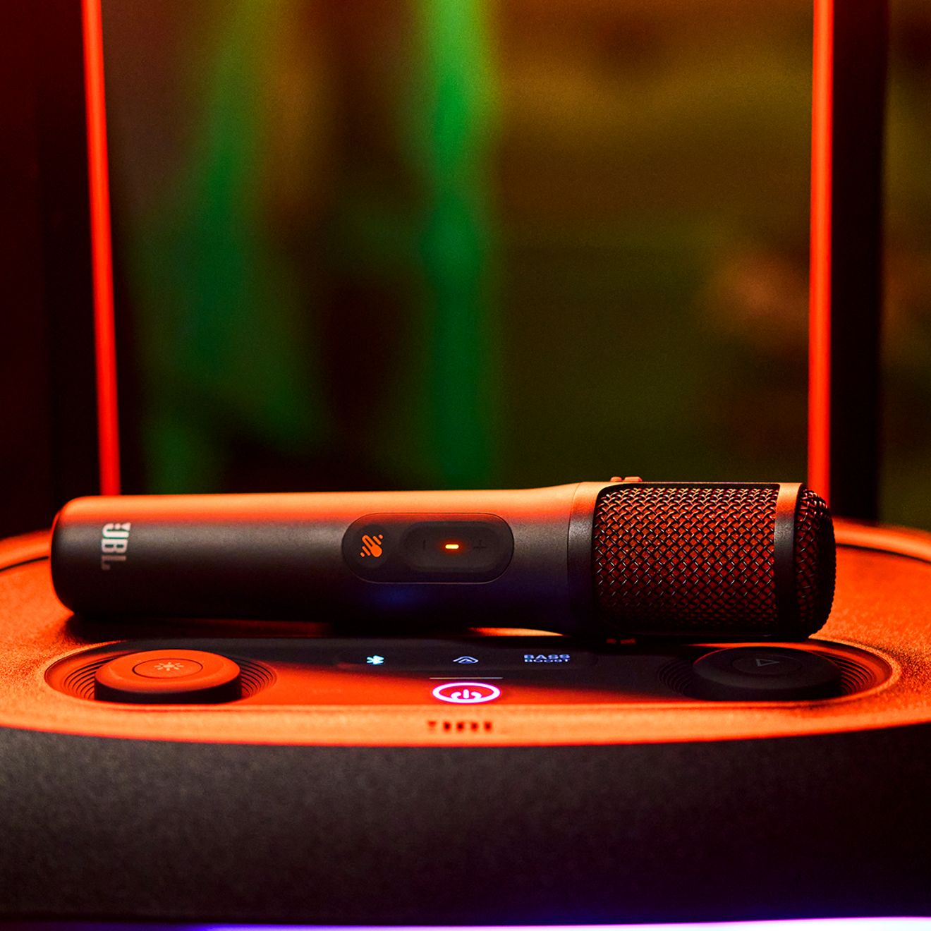 A close-up of the JBL Easy Sing Mics 2 with an orange accent.