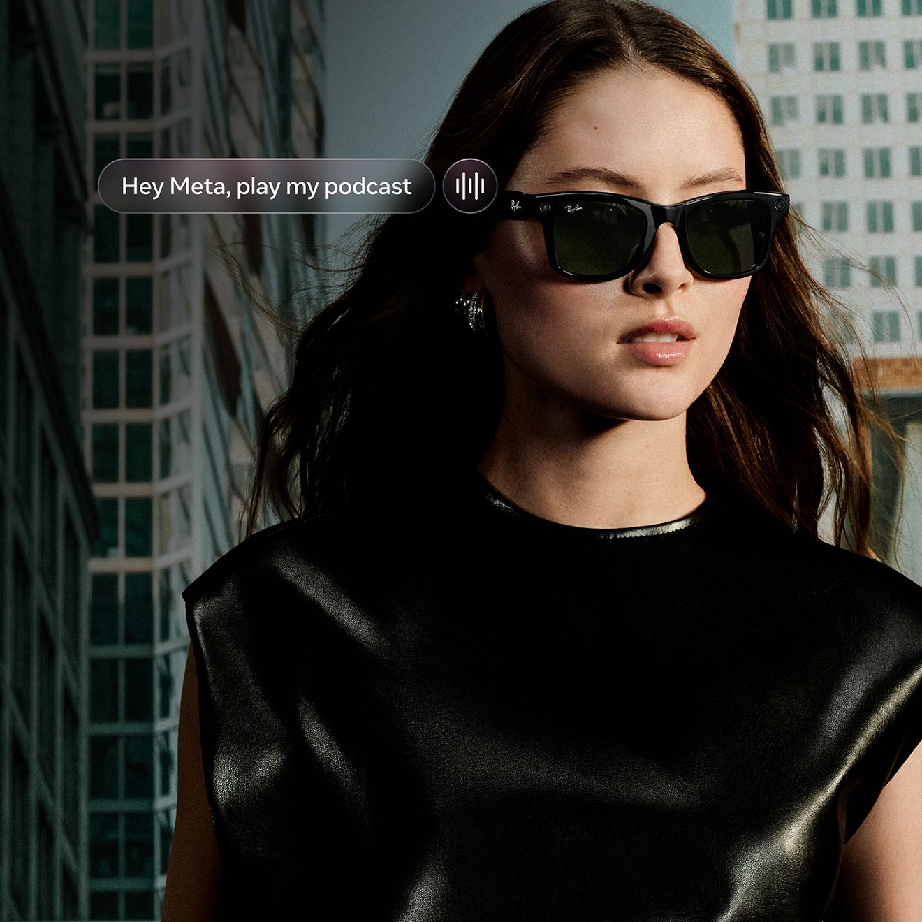 A woman walks down the street wearing her Ray-Ban Meta sunglasses.