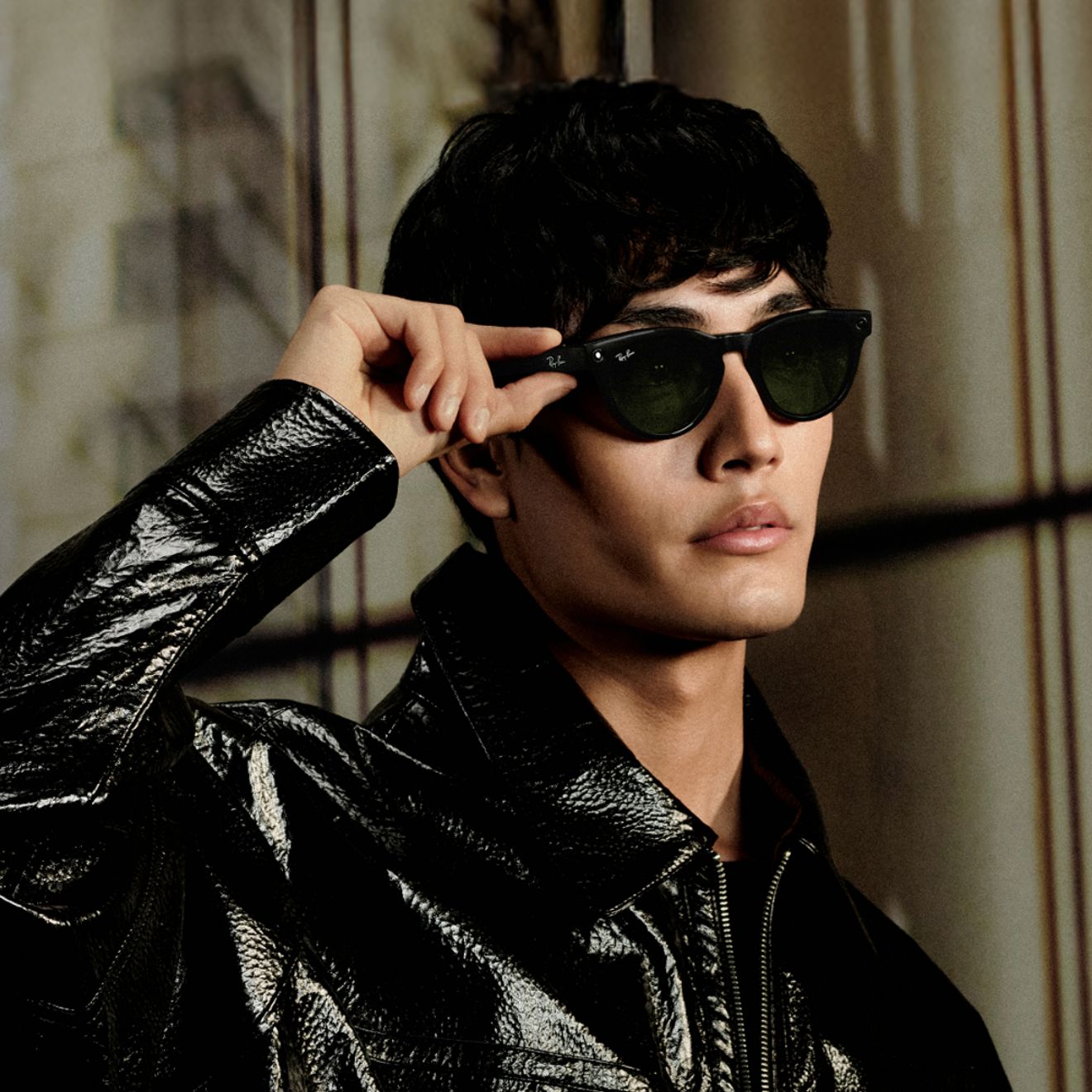 A woman wears her stylish Ray-Ban Meta sunglasses.