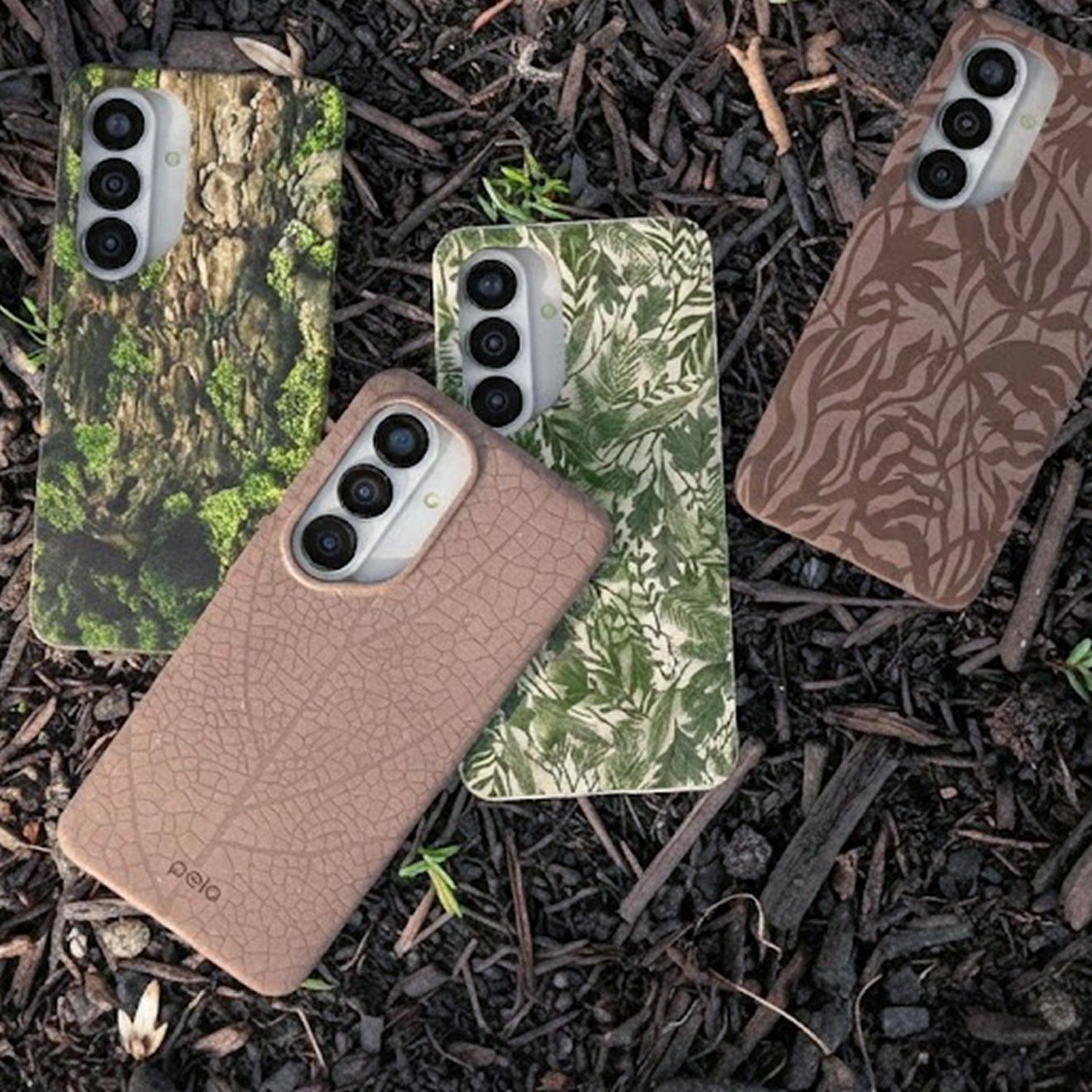 A group of four phones in Samsung Pela phone cases lay safely on the ground.