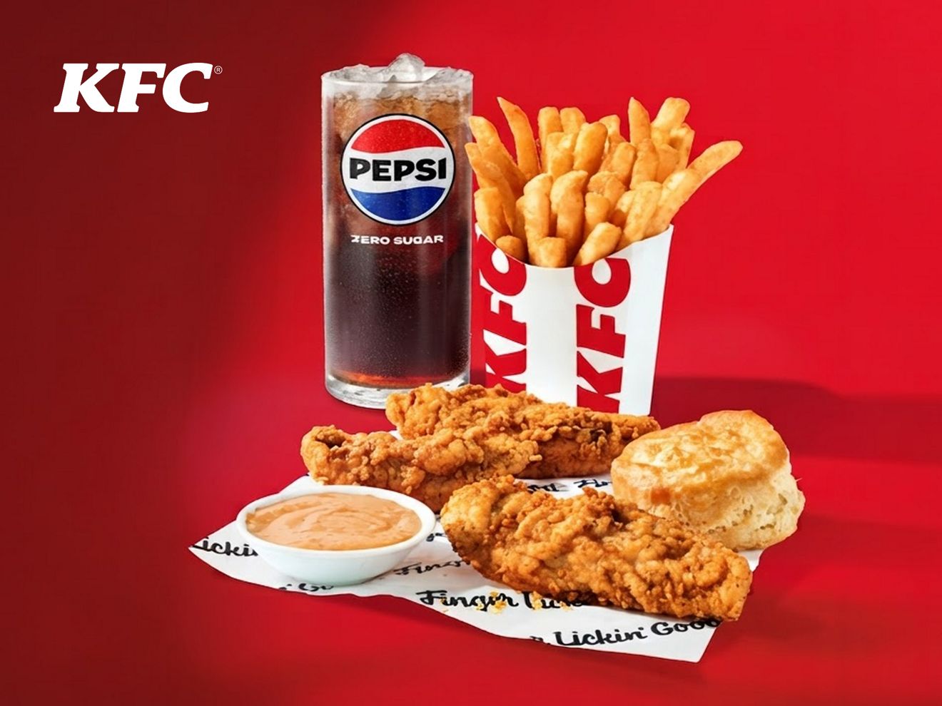 Un combo de tenders de KFC de 3 piezas con 3 tenders crujientes, una galleta, salsa para untar, papas fritas y una bebida Pepsi.