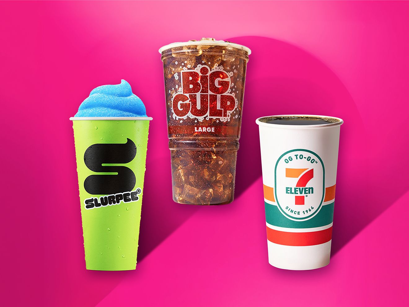 A blue Slurpee in a neon yellow cup, a cola-filled clear Big Gulp cup and a large cup of coffee resting on a magenta background. 