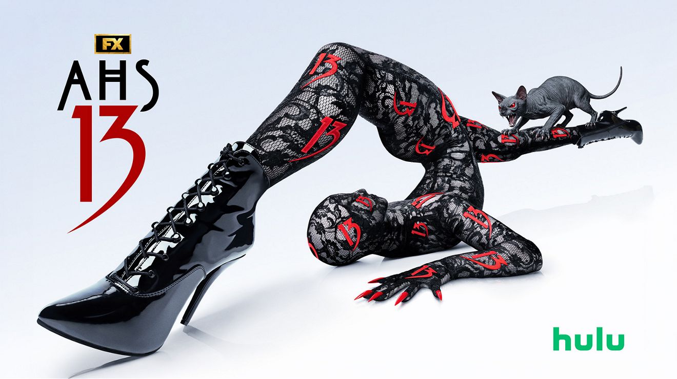 AHS 13 promotional graphic featuring a contorted figure in black boots with a cat nearby and Hulu logo.