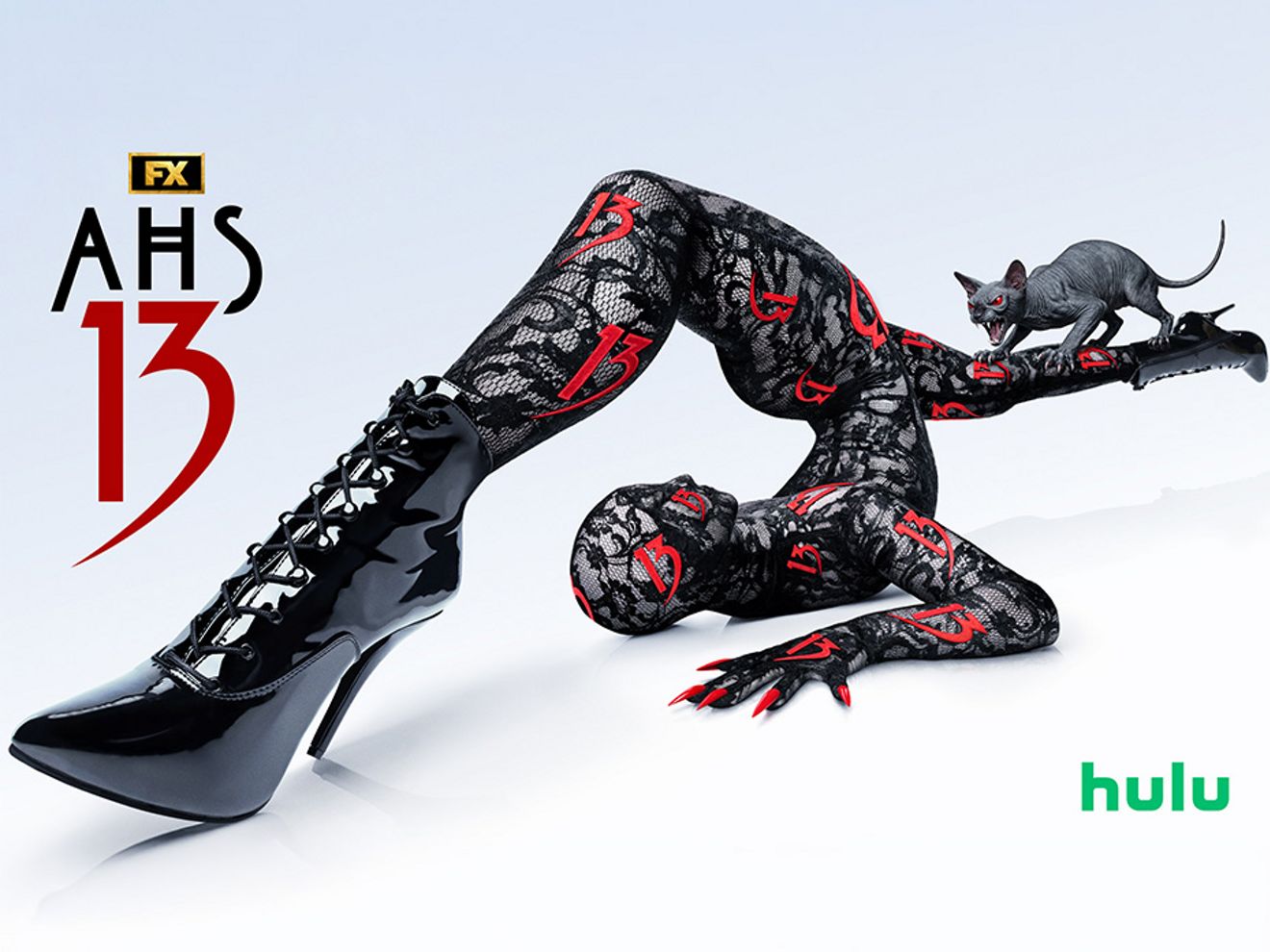 AHS 13 promotional graphic featuring a contorted figure in black boots with a cat nearby and Hulu logo.