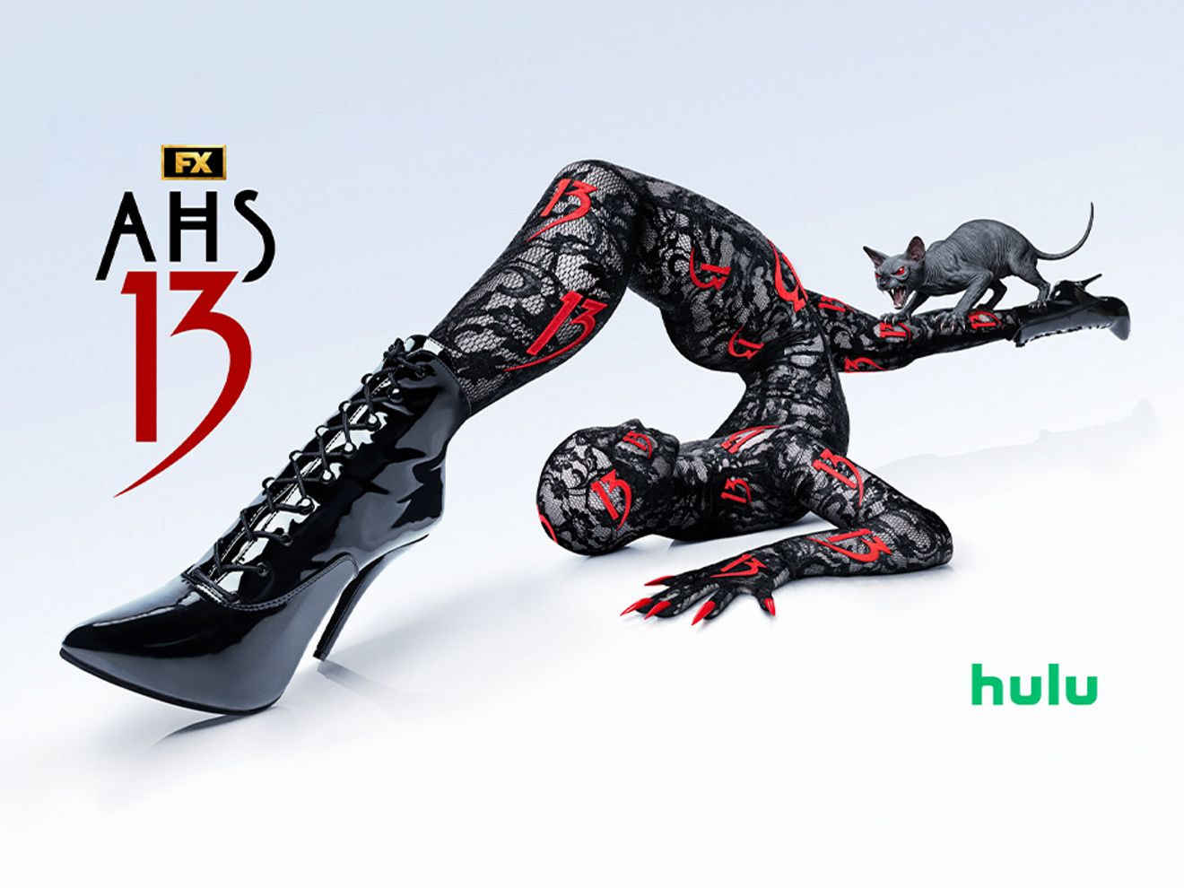 AHS 13 promotional graphic featuring a contorted figure in black boots with a cat nearby and Hulu logo.