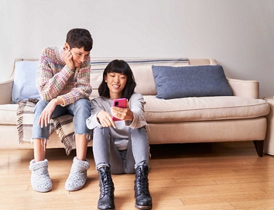 Man and woman looking at a phone