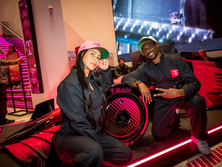 Two friends posing for a photo inside Club Magenta.