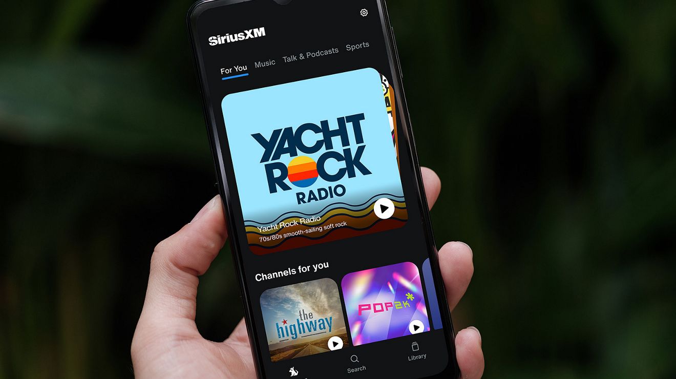 The largest image is of a hand holding a device with a Sirius XM app on screen.