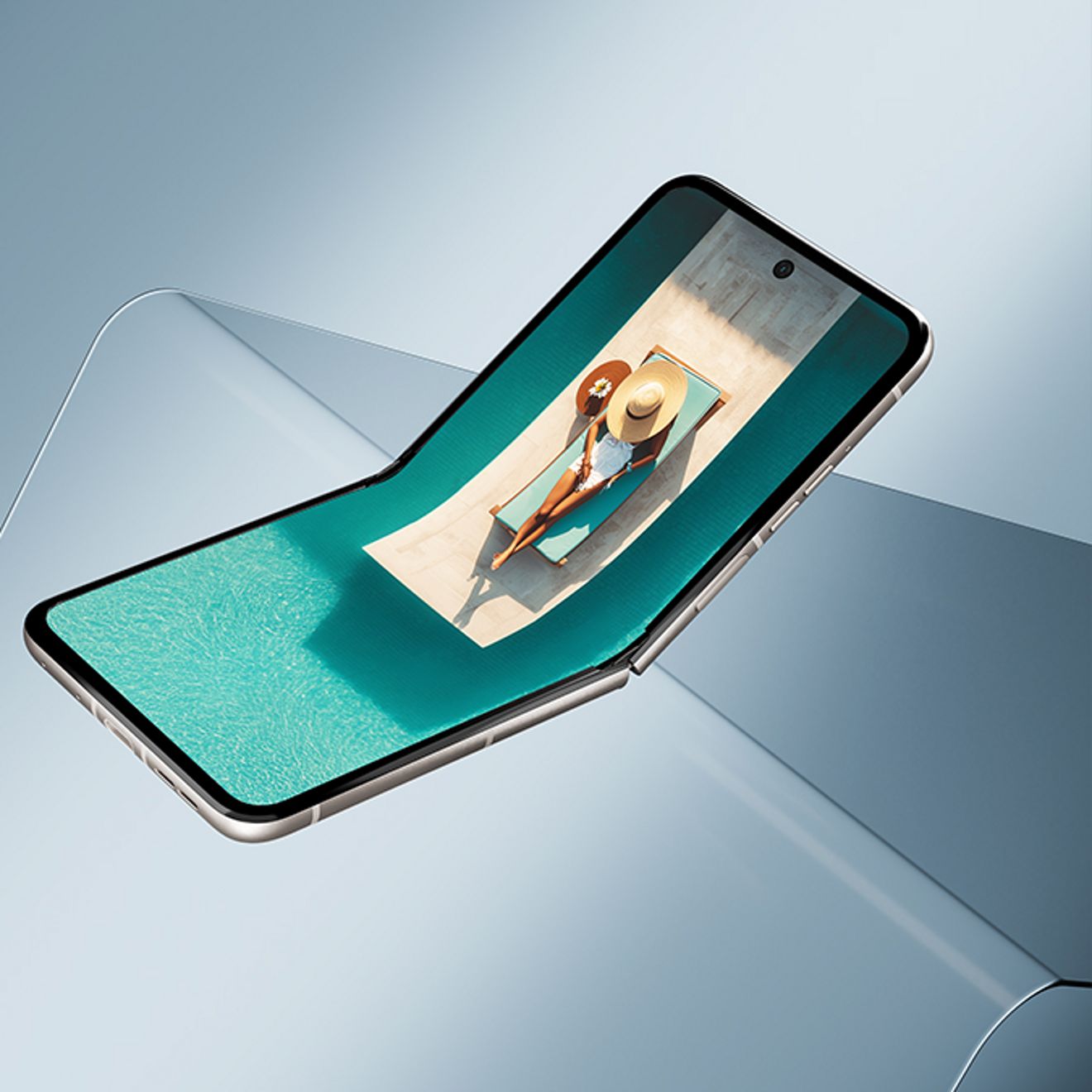 Motorola razr in gray, shown partially open with a flexible display curving upward over a flat surface.