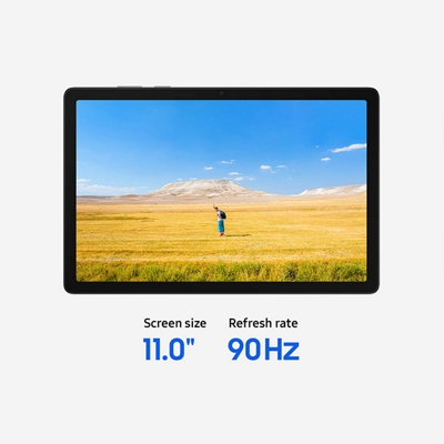 A Galaxy Tab A11+ 5G showing a wide, bright landscape with a lone figure in an open field.
