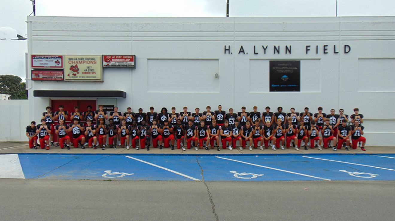 The Newton High School football team, lined up for a group photo.