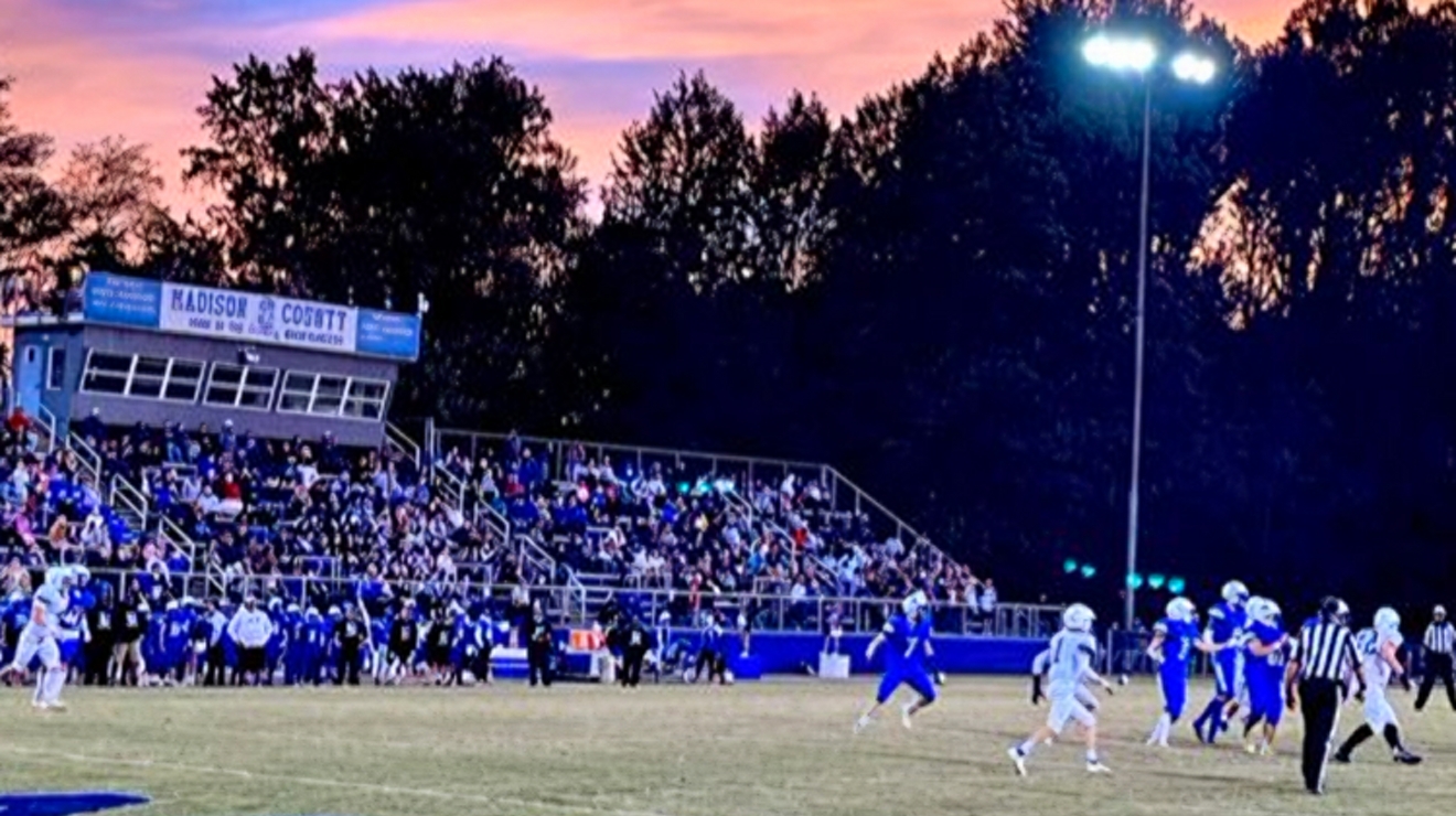The Madison County High School football field at sunset.