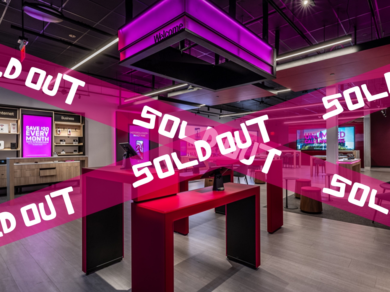Alderwood Mall T-Mobile Experience Store covered by Magenta tape printed with the words “sold out.”