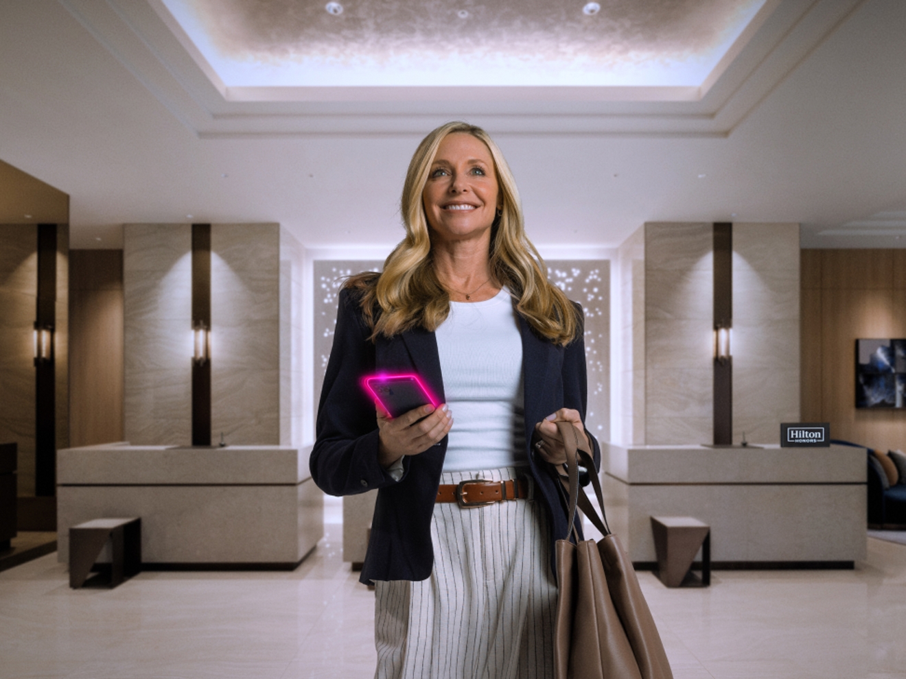 A woman walking through a hotel lobby