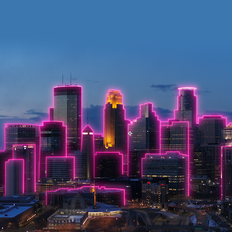 Minneapolis skyline at night outlined by magenta beams