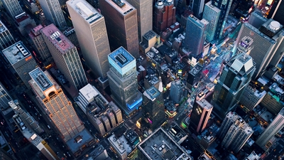 Looking down on city full of skyscrapers.