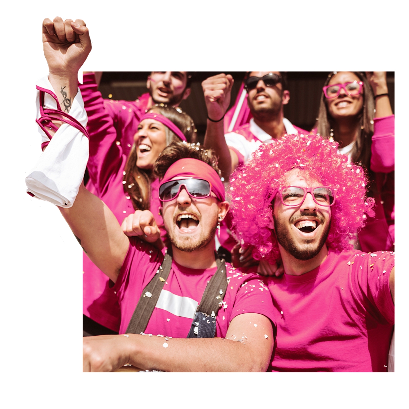  Fans cheer at a game while decked out in magenta. 
