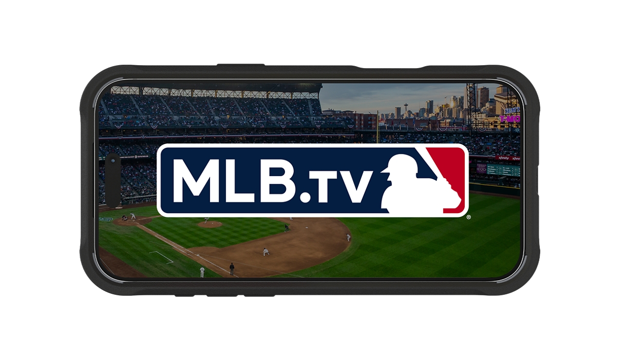 A baseball team huddles together in a moment coming out of a phone, which is propped up on a baseball.