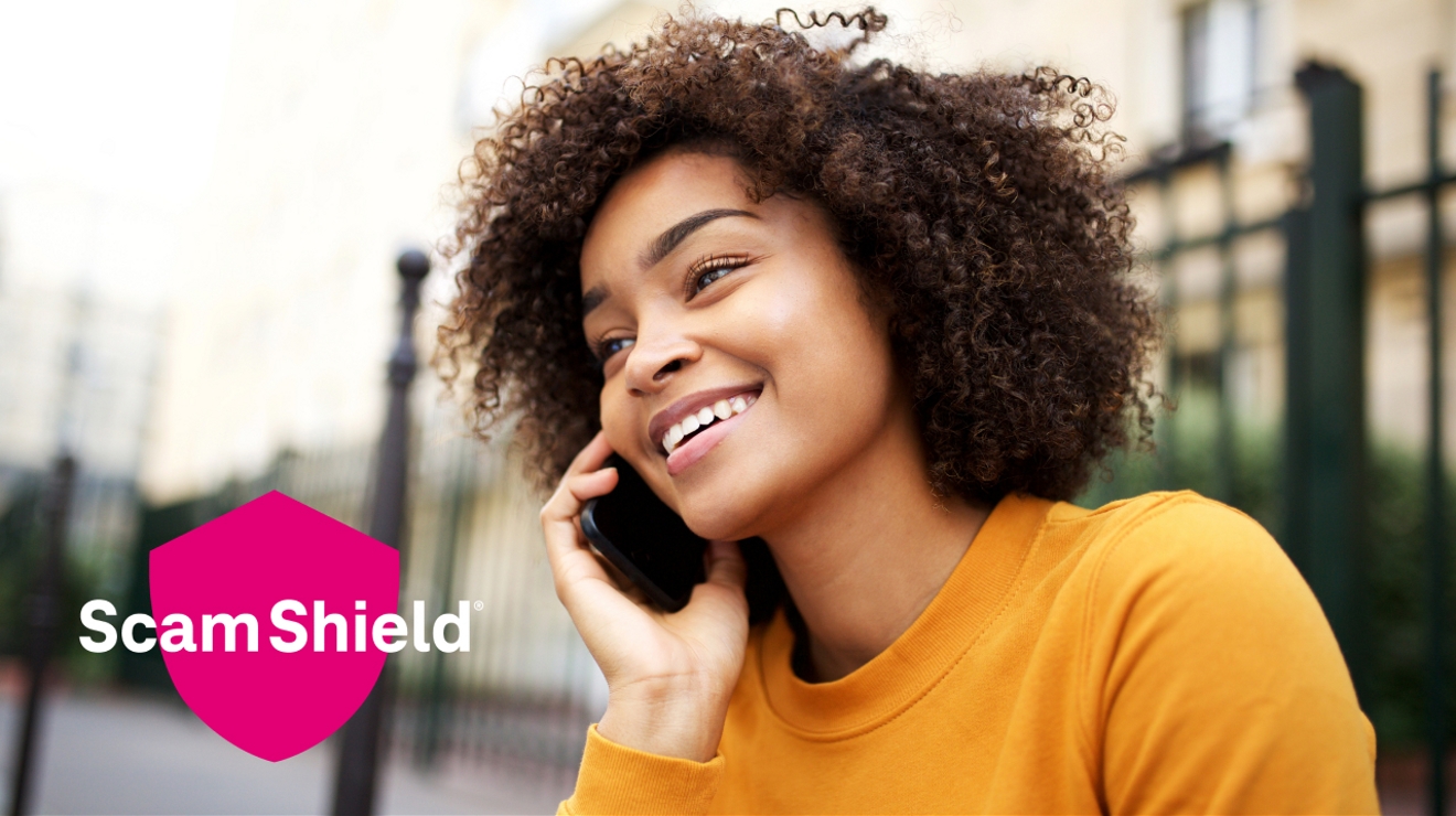Woman speaking on phone with “Scam Shield®” in a magenta shield displayed.