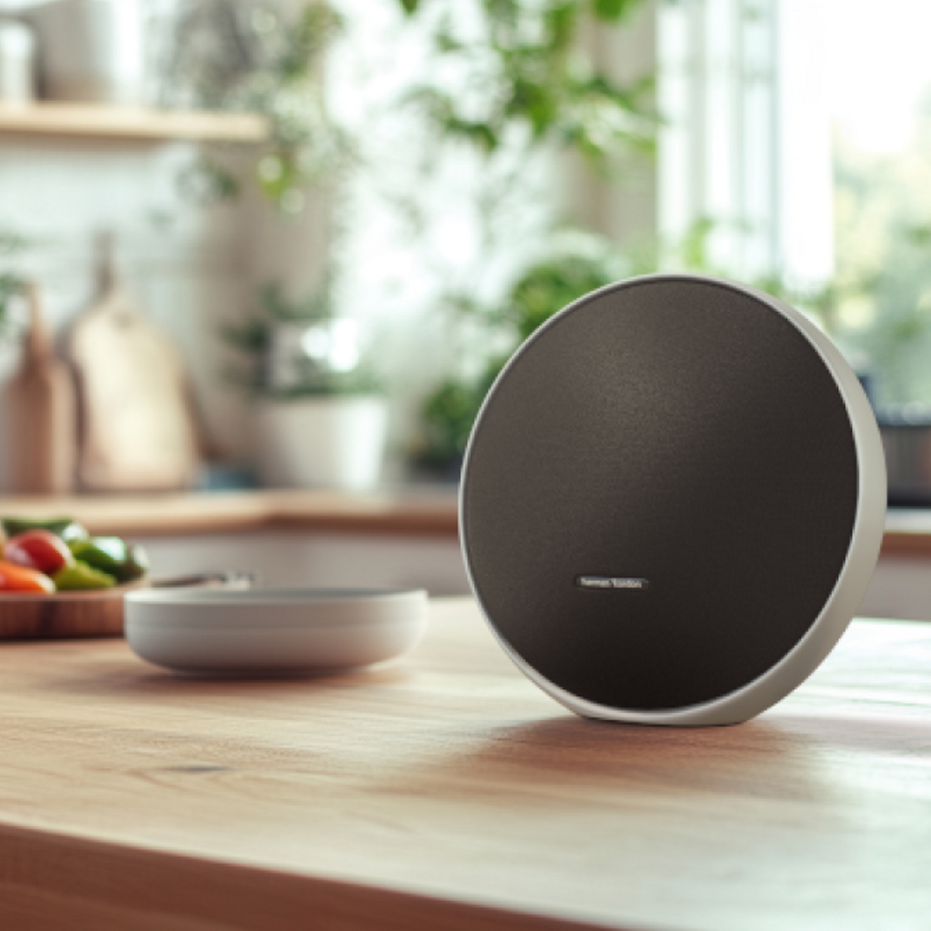 A close-up image of an Onyx Studio 9 speaker sitting on a kitchen counter.