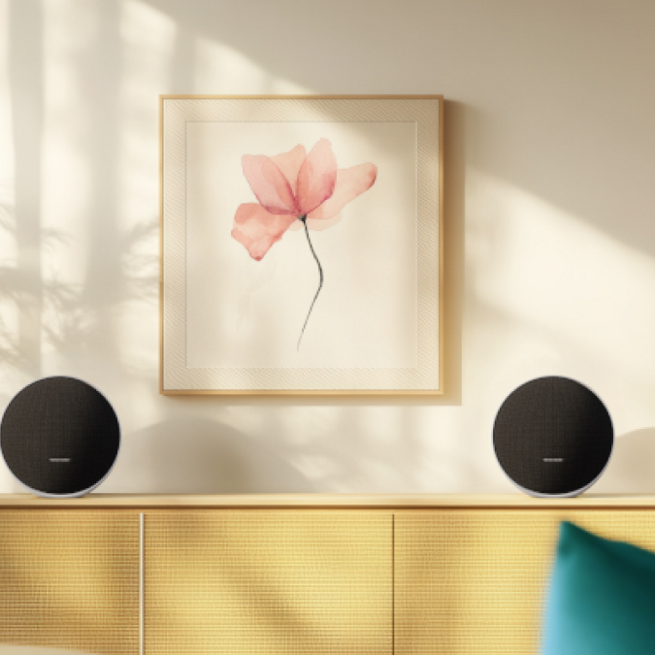 Two Onyx Studio 9 speakers sitting on opposite sides of a table.