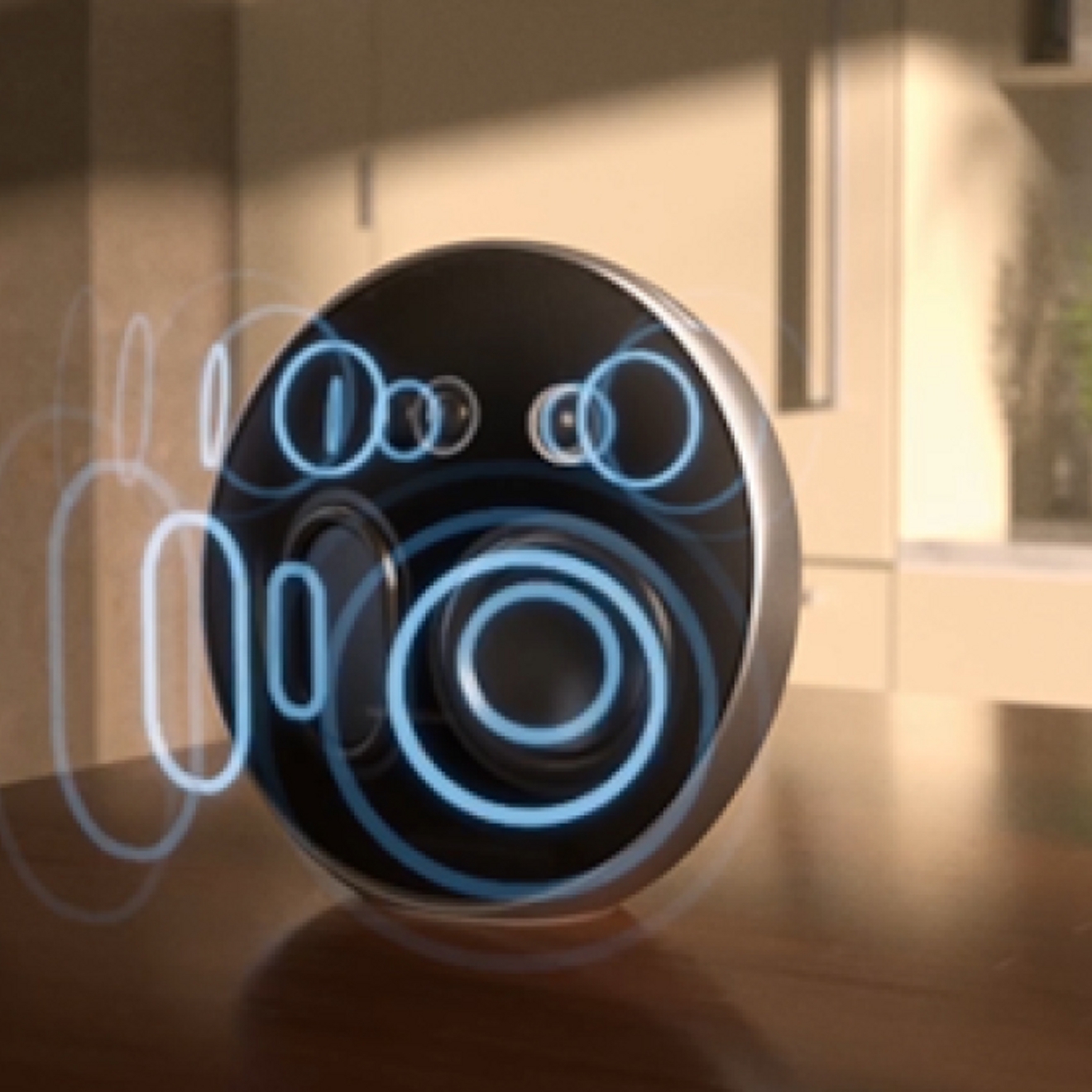 A close-up image of an Onyx Studio 9 speaker sitting on a table. There are photoshopped images of blue audio waves emitting from the speaker. 