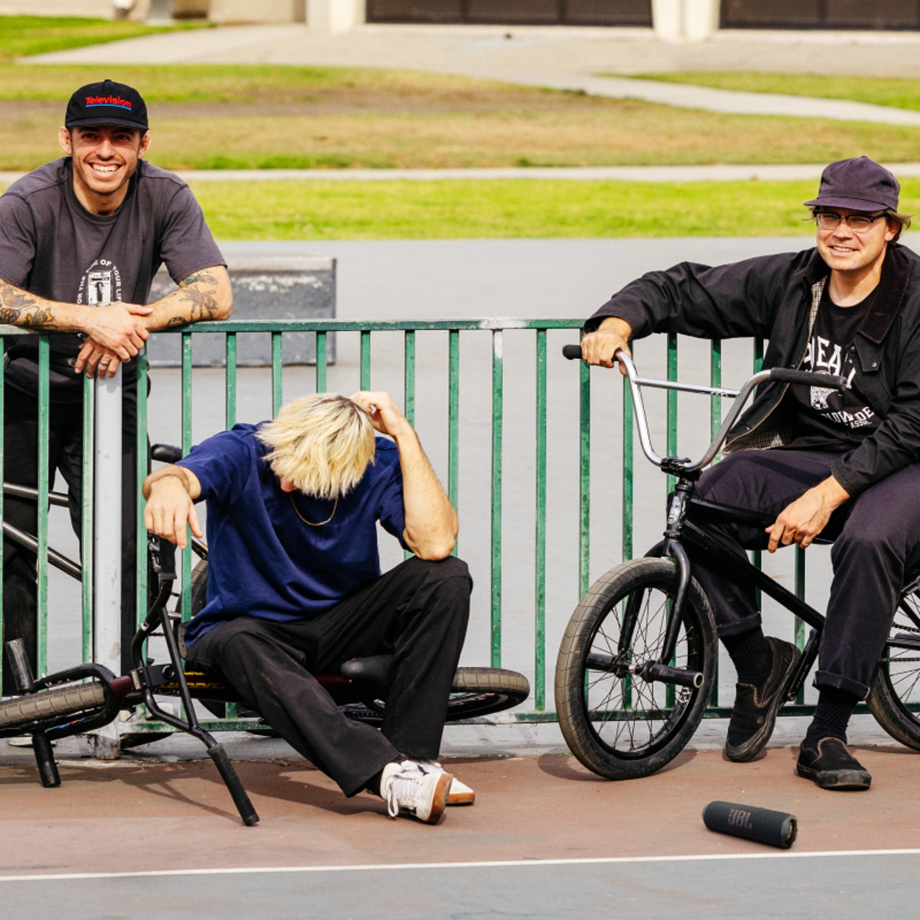 Three friends on bikes listening to a JBL Flip 7 device