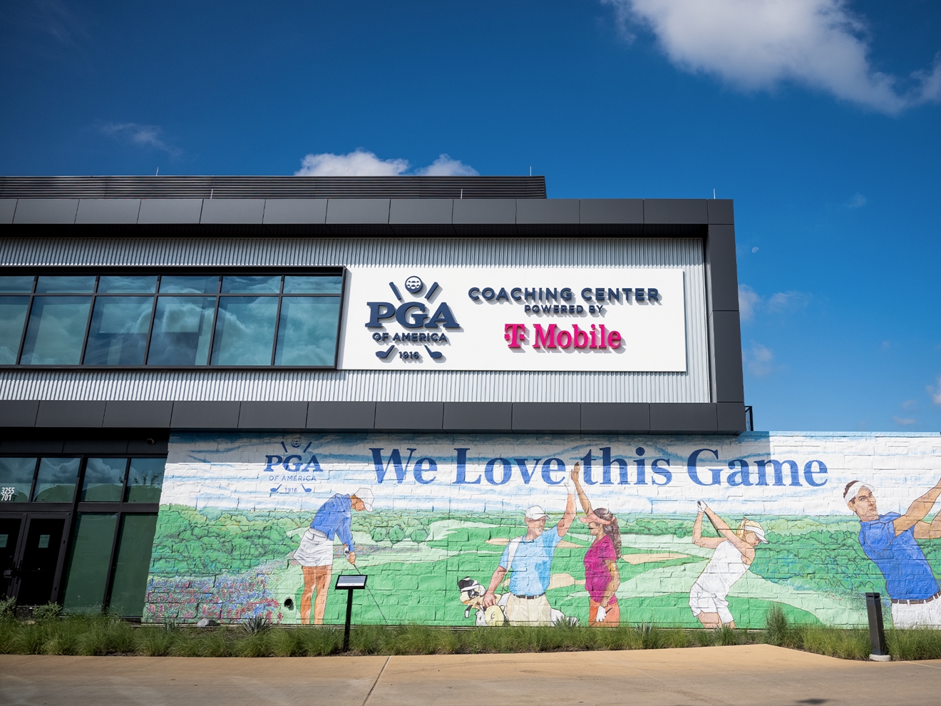PGA of America Coaching Center building exterior, featuring a golf-themed mural. 