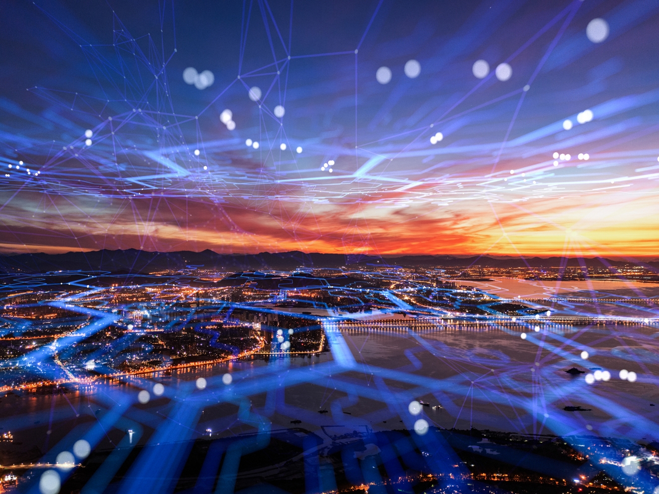 Aerial view of the city with cell network running through the city.