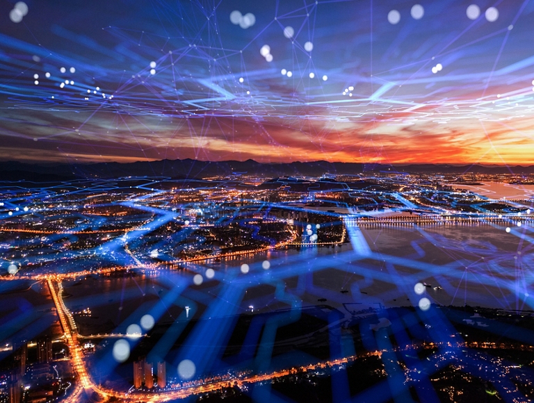 Aerial view of the city with cell network running through the city.