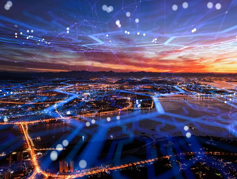 Aerial view of the city with cell network running through the city.