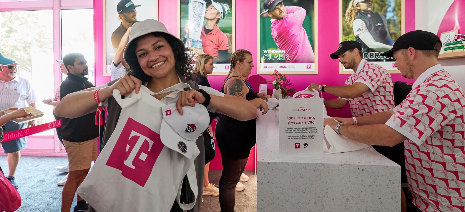 A T-Mobile member happily showing off her giveaway merch. 