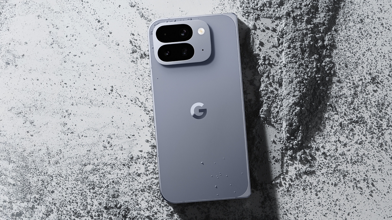 A silver Google Pixel 10 Pro Fold laying face-down on concrete.