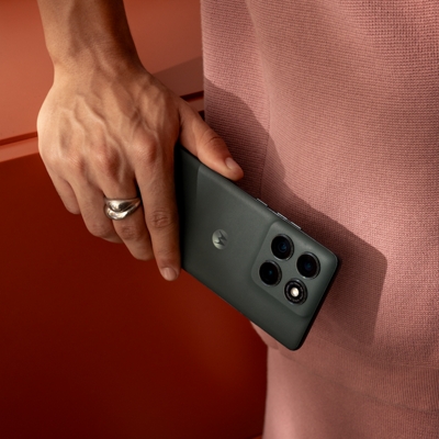 A close-up of a hand holding a moto edge.