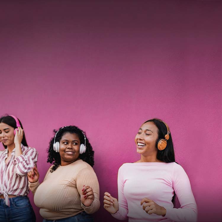 Two women wearing headphones.
