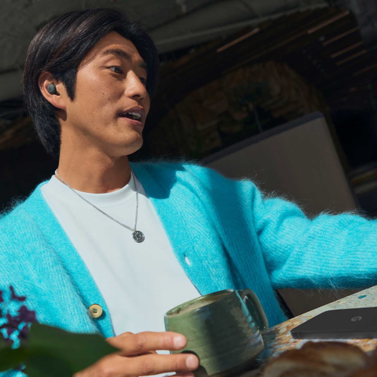 Man listening to Google Pixel Buds 2a device