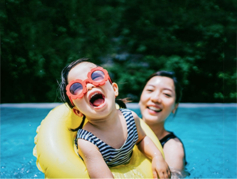 mother and daughter in swimming pool