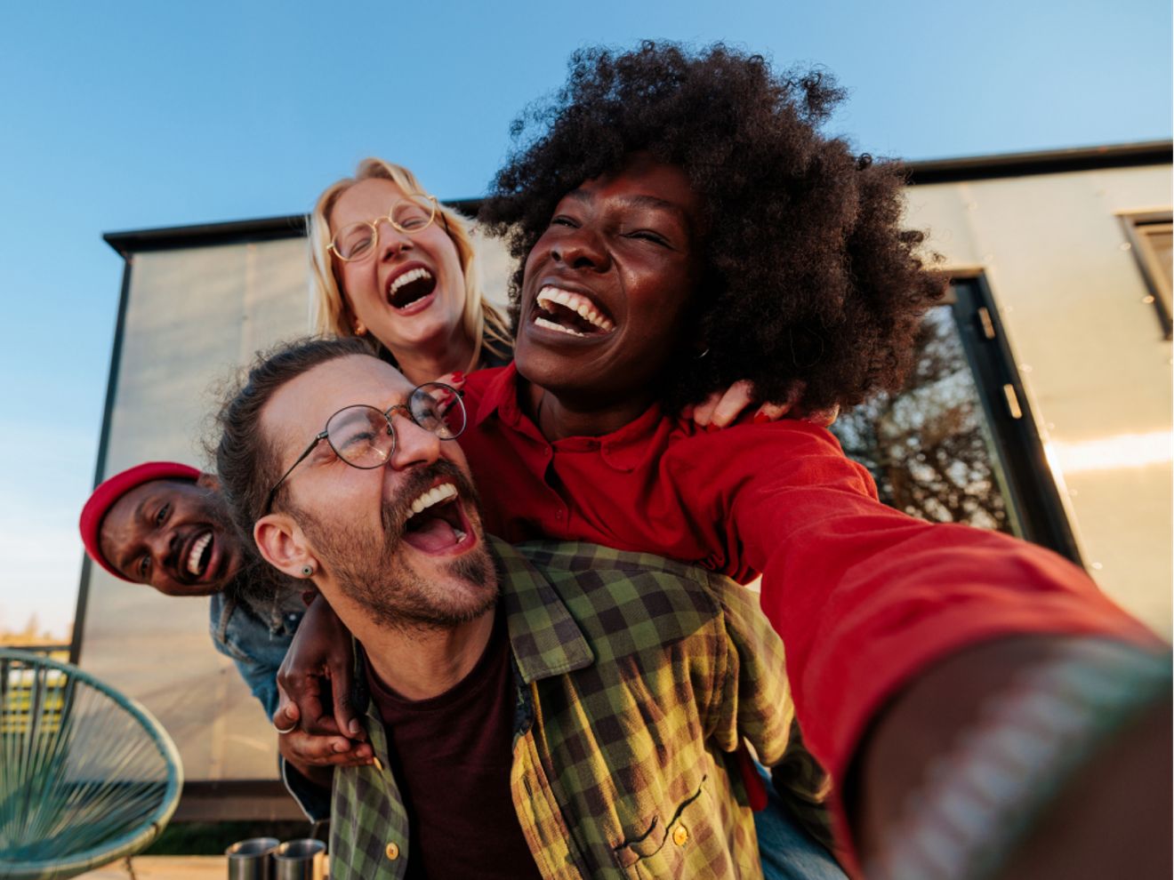 Three friends take a joyful selfie.