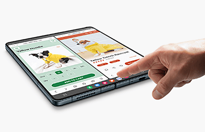 Samsung Galaxy Z Fold4 being touched by a hand.