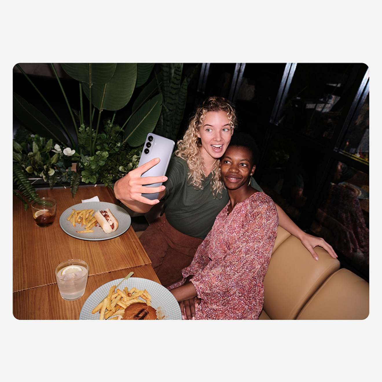 Two women gathered taking a selfie