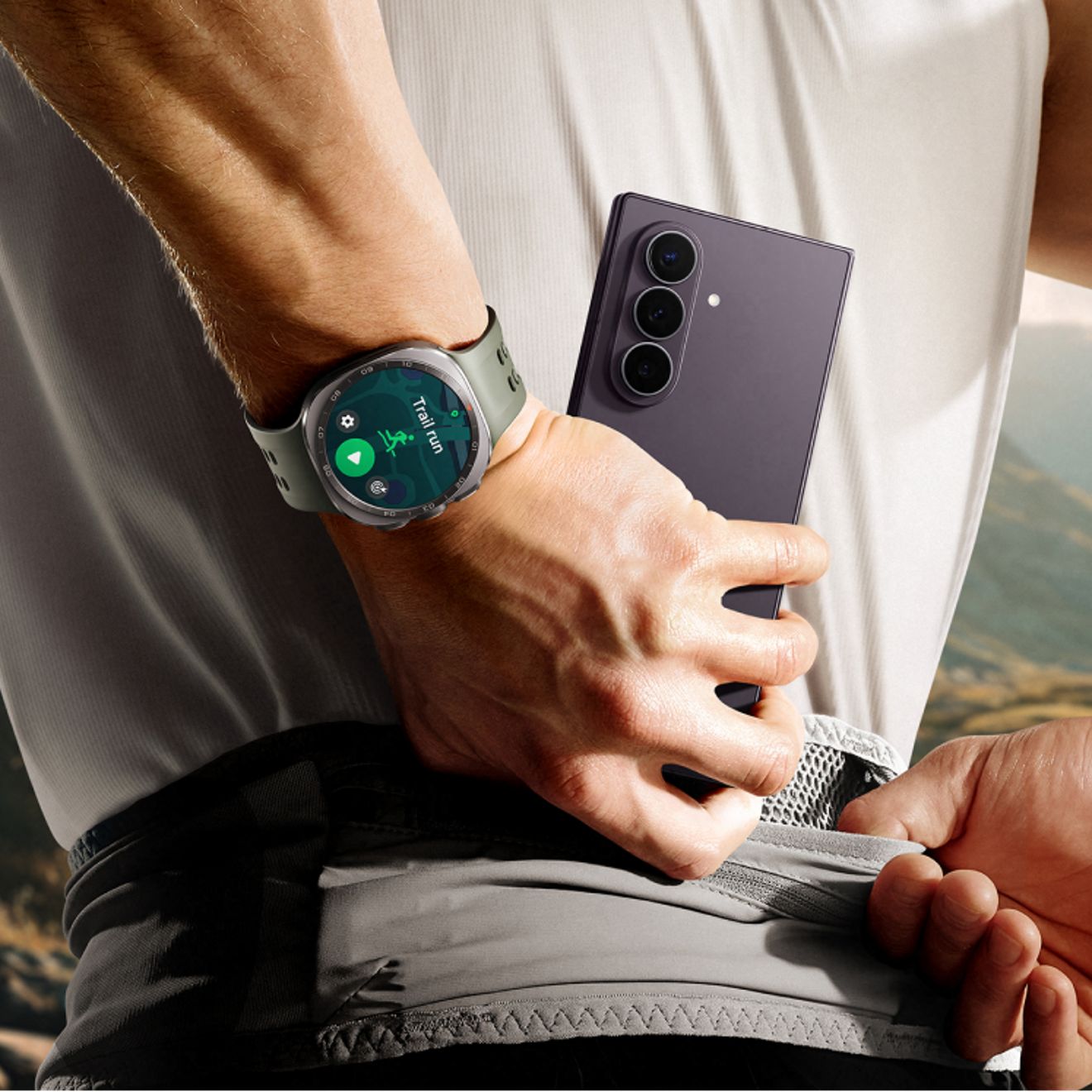 Samsung Galaxy Z Fold8 Ultra and Galaxy Watch shown during an outdoor workout, highlighting the triple-camera design and fitness tracking features.