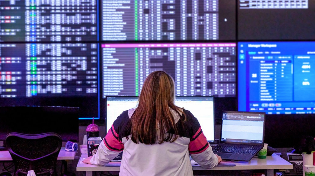 Woman sitting at a comand center