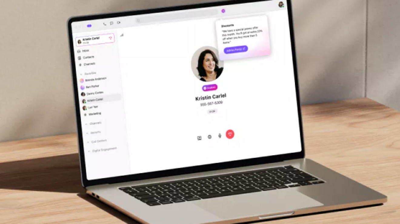 A laptop on a desk displays a Dialpad Ai Sales Center UX.