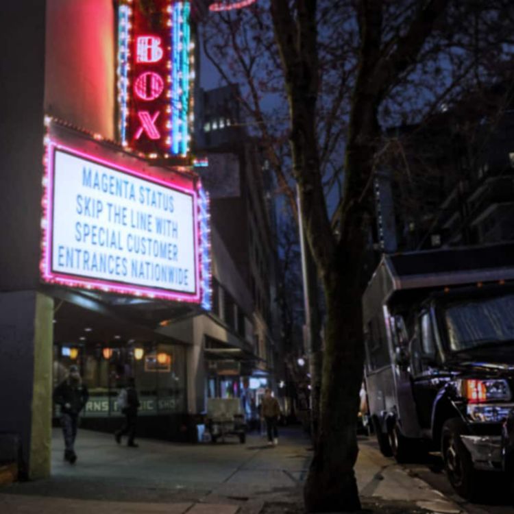 A theater marquee reads magenta status skip the line with special customer entrances nationwide.