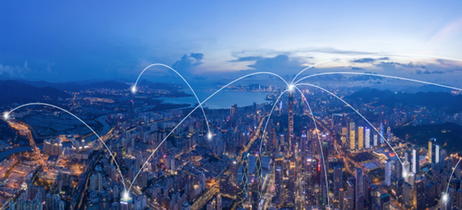 A modern urban skyline connected by robust wireless network infrastructure.